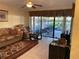 Comfortable living room with access to a screened patio at 5105 Garden Vale Ave, Tampa, FL 33624