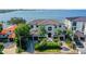 Impressive waterfront home with a large driveway and manicured lawn at 5120 W Longfellow Ave, Tampa, FL 33629