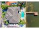 Waterfront property showcasing home, pool, and private dock at 5120 W Longfellow Ave, Tampa, FL 33629