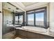 Luxurious bathroom with soaking tub and walk-in shower at 5120 W Longfellow Ave, Tampa, FL 33629