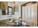 Elegant bathroom with granite countertop, updated sink, and shower at 5120 W Longfellow Ave, Tampa, FL 33629