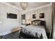 Serene bedroom with a queen-size bed and dark floors at 5120 W Longfellow Ave, Tampa, FL 33629