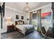 Cozy bedroom with a double bed and dark wood floors at 5120 W Longfellow Ave, Tampa, FL 33629