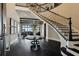 Grand foyer with a sweeping staircase and dark hardwood floors at 5120 W Longfellow Ave, Tampa, FL 33629