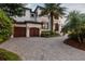 Luxury home with a two-car garage and expansive driveway at 5120 W Longfellow Ave, Tampa, FL 33629