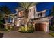 Elegant two-story home with a grand entrance and meticulous landscaping at 5120 W Longfellow Ave, Tampa, FL 33629