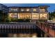 Home's exterior showcasing modern architecture and waterfront location at night at 5120 W Longfellow Ave, Tampa, FL 33629
