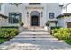 Elegant entryway with double doors and stone steps at 5120 W Longfellow Ave, Tampa, FL 33629