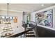 Upper hallway with modern art and a chandelier at 5120 W Longfellow Ave, Tampa, FL 33629