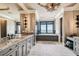 Elegant bathroom with a soaking tub and double vanity at 5120 W Longfellow Ave, Tampa, FL 33629