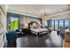 Luxurious main bedroom with water views and sitting area at 5120 W Longfellow Ave, Tampa, FL 33629