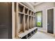 Functional mudroom with built-in cubbies and bench seating at 5120 W Longfellow Ave, Tampa, FL 33629