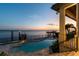 Inviting pool area with waterfront views and sunset backdrop at 5120 W Longfellow Ave, Tampa, FL 33629