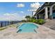 Inviting pool area with expansive patio, offering serene water views at 5120 W Longfellow Ave, Tampa, FL 33629