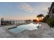 Relaxing pool area with spa and water views at sunset at 5120 W Longfellow Ave, Tampa, FL 33629