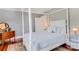 Charming bedroom with a four-poster bed and hardwood floors at 602 33Rd Street W Ct, Bradenton, FL 34205