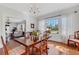 Bright dining room with hardwood floors, large window, and view to the living room at 602 33Rd Street W Ct, Bradenton, FL 34205