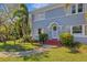 Front view of a charming two-story house with steps at 602 33Rd Street W Ct, Bradenton, FL 34205