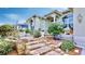 Welcoming entryway with brick stairs and charming landscaping at 706 Eagle Ln, Apollo Beach, FL 33572