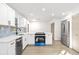 Modern kitchen with white cabinets and stainless steel appliances at 8057 Shaw Rd, Brooksville, FL 34602