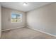 Well-lit bedroom with neutral walls and carpet flooring at 921 Orangeview Dr, Largo, FL 33778