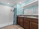 Bathroom with shower, double vanity, and granite countertop at 9626 Channing Hill Dr, Ruskin, FL 33573