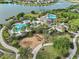 Aerial view of a community playground next to the pool and clubhouse at 9626 Channing Hill Dr, Ruskin, FL 33573