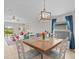 Dining area with a wooden table and chairs, open to the living room at 9626 Channing Hill Dr, Ruskin, FL 33573