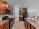 Modern kitchen with stainless steel appliances and wood cabinets at 9626 Channing Hill Dr, Ruskin, FL 33573
