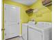 Laundry room with washer, dryer, and overhead shelving at 9626 Channing Hill Dr, Ruskin, FL 33573