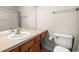 Bathroom with double vanity and toilet at 10334 Estero Bay Ln, Tampa, FL 33625