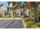 Townhome building with light gray siding and landscaping at 10334 Estero Bay Ln, Tampa, FL 33625