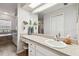 Bathroom boasts a vanity with granite countertop and a large mirror at 1121 Belladonna Dr, Brandon, FL 33510