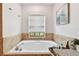 Relaxing bathroom with a large garden tub and tile surround at 1121 Belladonna Dr, Brandon, FL 33510