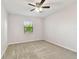 Bright bedroom featuring neutral walls and plush carpeting at 1121 Belladonna Dr, Brandon, FL 33510