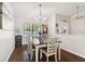 Dining room with large table and hardwood floors at 1121 Belladonna Dr, Brandon, FL 33510