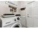 Laundry room with washer, dryer, and additional storage at 1121 Belladonna Dr, Brandon, FL 33510