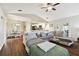 Spacious living room with gray sectional sofa and wood floors at 1121 Belladonna Dr, Brandon, FL 33510