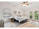 Main bedroom with king-size bed and sliding glass doors leading to the backyard at 1121 Belladonna Dr, Brandon, FL 33510