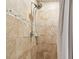 Clean shower with beige tile and a handheld shower head at 1121 Belladonna Dr, Brandon, FL 33510