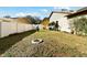 Landscaped side yard with fire pit and privacy fence at 1121 Belladonna Dr, Brandon, FL 33510