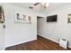 Cozy spare bedroom with hardwood floors and a wall-mounted TV at 1121 Belladonna Dr, Brandon, FL 33510