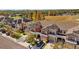 An aerial view of the townhomes featuring a lake, manicured lawns, and well-maintained landscaping at 11546 Crowned Sparrow Ln, Tampa, FL 33626