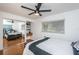 Cozy bedroom with a double bed, ceiling fan, and built-in shelving at 1201 Kapok Cir, Clearwater, FL 33759