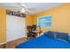 Multi-purpose bedroom with a desk, bed, and ample closet space at 1201 Kapok Cir, Clearwater, FL 33759