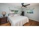 Spacious primary bedroom featuring a king-size bed and ample natural light at 1201 Kapok Cir, Clearwater, FL 33759