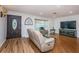 Bright living room with hardwood floors and comfy seating at 1201 Kapok Cir, Clearwater, FL 33759