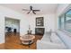 Comfortable living room with a fireplace and access to an office at 1201 Kapok Cir, Clearwater, FL 33759