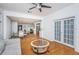 Open concept living room with hardwood floors and view of dining area at 1201 Kapok Cir, Clearwater, FL 33759