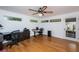 Home office featuring hardwood floors, and access to the backyard at 1201 Kapok Cir, Clearwater, FL 33759
